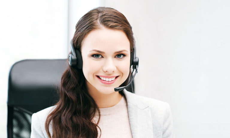 Virtual receptionist at her desk and smiling
